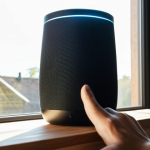**

"A person calibrating a gesture-controlled smart speaker in a modern Swedish home. The user is holding their hand up to the speaker, and the speaker is displaying a visual confirmation on its LED screen. Sunlight streaming through the window illuminates the scene."

**